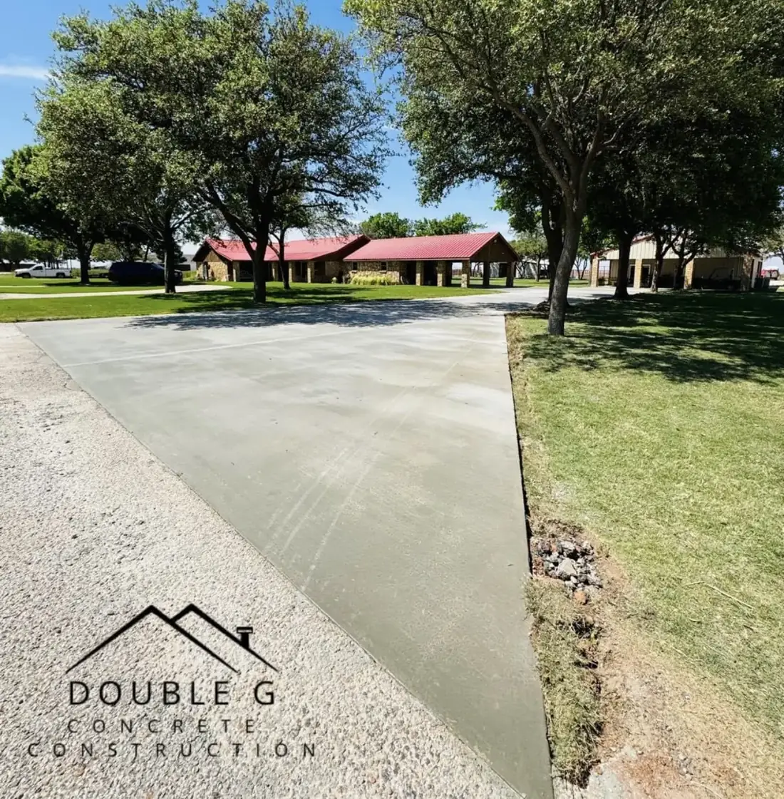 Freshly finished concrete driveway approach poured by Double G Concrete Construction