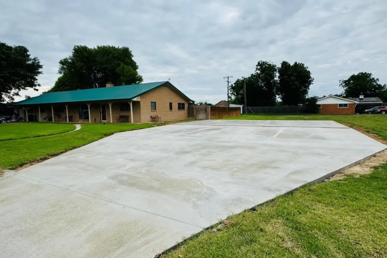 Concrete slab poured beside a home by Double G Concrete Construction